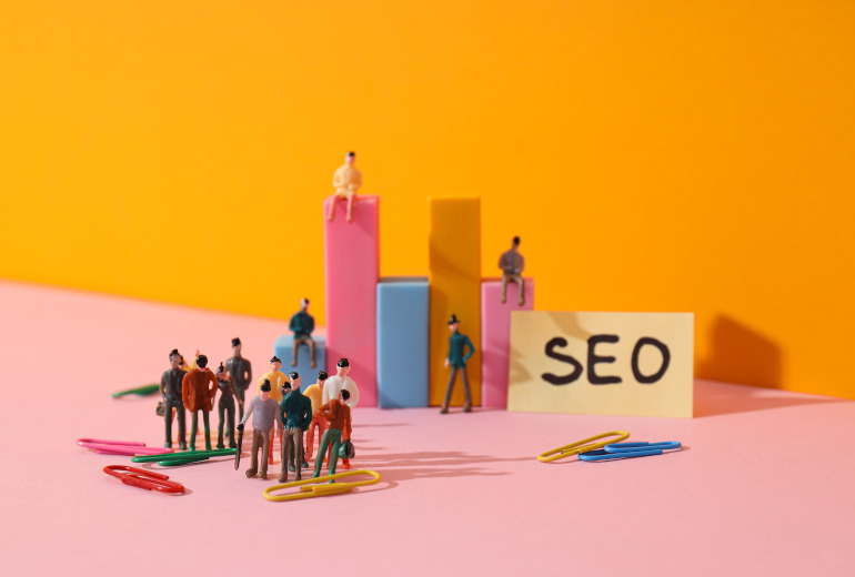 Diagram, paper with SEO letters, paper clips and people on yello Diagram, paper with SEO letters, paper clips and people on yellow background